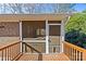 Screened porch with wooden railing, offering a relaxing outdoor space at 2913 Archdale Dr, Charlotte, NC 28210