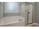 Bathroom featuring a large tub with modern fixtures and a glass-enclosed shower at 3301 Brackhill St, Davidson, NC 28036