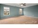 Spacious bedroom featuring lots of natural light and neutral paint at 3301 Brackhill St, Davidson, NC 28036