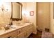 Traditional bathroom featuring floral wallpaper, a marble countertop vanity, and decorative accents at 404 Downing Dr, Kings Mountain, NC 28086