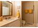Bathroom with marble counter, and striped wallpaper at 404 Downing Dr, Kings Mountain, NC 28086