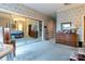 Bedroom with a mirrored closet reflecting the bed, dressers, and stylish wallpaper at 404 Downing Dr, Kings Mountain, NC 28086