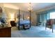 Spacious bedroom featuring a four-poster bed and chandelier at 404 Downing Dr, Kings Mountain, NC 28086