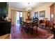 Formal dining room with a large wooden table, decorative wallpaper, and chandelier at 404 Downing Dr, Kings Mountain, NC 28086