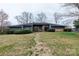 Charming single-story home with a well-manicured front yard and mature landscaping at 404 Downing Dr, Kings Mountain, NC 28086