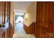 Carpeted hallway with wainscoting and multiple doors leading to different rooms at 404 Downing Dr, Kings Mountain, NC 28086