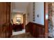 Hallway with wood and stone accents, leading to other rooms with hardwood flooring and carpet at 404 Downing Dr, Kings Mountain, NC 28086