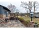 Picturesque patio with wrought iron furniture overlooking the yard and lake at 404 Downing Dr, Kings Mountain, NC 28086