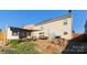 View of the home's backyard featuring a patio area, a shed, and stone landscaping at 417 Galesburg Dr, Monroe, NC 28110
