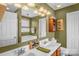 Bathroom with a double sink vanity, a large mirror, and modern fixtures at 417 Galesburg Dr, Monroe, NC 28110