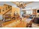Well-lit dining area featuring a wooden table and a partial view into a living room at 417 Galesburg Dr, Monroe, NC 28110