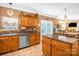 Bright kitchen with stainless steel appliances, wooden cabinets, and an island at 417 Galesburg Dr, Monroe, NC 28110