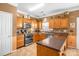 Functional kitchen with wooden cabinetry, modern appliances, and ample counter space at 417 Galesburg Dr, Monroe, NC 28110