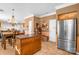 Open kitchen with island and stainless steel appliances, connected to the dining area at 417 Galesburg Dr, Monroe, NC 28110