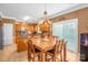 Eat-in kitchen featuring wood cabinets, stainless steel appliances, and a central island at 417 Galesburg Dr, Monroe, NC 28110