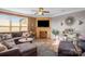 Cozy living room featuring a brick fireplace, TV, and comfortable seating arrangement at 417 Galesburg Dr, Monroe, NC 28110