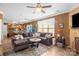 Spacious living room with a fireplace, ceiling fan, and ample natural light at 417 Galesburg Dr, Monroe, NC 28110