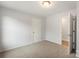 This spacious bedroom features neutral walls, carpet, and an opening to another room at 419 N Caldwell St # 1, Salisbury, NC 28144