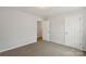 Bright bedroom features neutral walls, carpet, and an opening to another room at 419 N Caldwell St # 1, Salisbury, NC 28144
