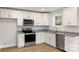 Modern kitchen features white cabinets, stainless steel appliances, and granite countertops at 419 N Caldwell St # 1, Salisbury, NC 28144