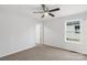 Bedroom features neutral carpeting, white walls, ceiling fan, and a bright window at 423 N Caldwell St # 2, Salisbury, NC 28144