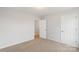 Bedroom featuring neutral carpet, light walls, and white doors, creating a calm atmosphere at 423 N Caldwell St # 2, Salisbury, NC 28144