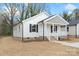 Well-maintained single-Gathering home showcasing its charming front porch and neat landscaping at 423 N Caldwell St # 2, Salisbury, NC 28144