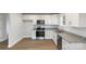 Kitchen features stainless appliances, granite countertops and white cabinetry with modern hardware at 423 N Caldwell St # 2, Salisbury, NC 28144