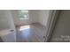 Bright and airy bedroom featuring new flooring and a window at 425 Whitethorn Dr, Gastonia, NC 28054
