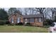 Charming brick home with well-maintained lawn and classic architectural details at 425 Whitethorn Dr, Gastonia, NC 28054
