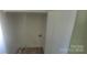 Empty laundry room with white walls, flooring and hookups for a washer and dryer at 425 Whitethorn Dr, Gastonia, NC 28054