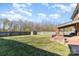 Expansive backyard with lush lawn, mature trees, and great shade at 4405 Ashton Ct, Indian Trail, NC 28079