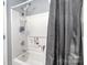 This bathroom features a tub and shower combination with updated fixtures at 4405 Ashton Ct, Indian Trail, NC 28079