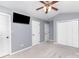Bedroom with vaulted ceilings, neutral gray paint, a ceiling fan, and an attached closet at 4405 Ashton Ct, Indian Trail, NC 28079