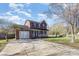 Two-story brick home featuring a large driveway and well-manicured lawn at 4405 Ashton Ct, Indian Trail, NC 28079