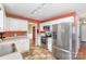 Features stainless steel appliances, white cabinets, tile flooring, and an eat-in kitchen area at 4405 Ashton Ct, Indian Trail, NC 28079