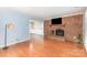 Spacious living room with fireplace, hardwood floors, and ample natural light at 4405 Ashton Ct, Indian Trail, NC 28079