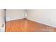 Open living space with hardwood floors, great natural light, and white trim at 4405 Ashton Ct, Indian Trail, NC 28079