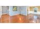 Open-concept living room with hardwood floors, neutral walls, and plenty of space at 4405 Ashton Ct, Indian Trail, NC 28079