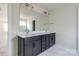 Bathroom featuring double vanity with dark wood cabinets and expansive mirror at 50 Sherwood Nw Ct # Sw50, Concord, NC 28027