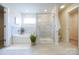 Bright bathroom showcasing a soaking tub, glass-enclosed shower, and modern finishes at 50 Sherwood Nw Ct # Sw50, Concord, NC 28027