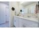 Bathroom featuring a double vanity, white cabinets, and modern faucets at 50 Sherwood Nw Ct # Sw50, Concord, NC 28027