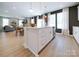 Bright, open-concept kitchen with island, stainless steel appliances, and easy flow to the dining and living areas at 50 Sherwood Nw Ct # Sw50, Concord, NC 28027