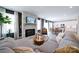 Spacious living room featuring a stone fireplace and an open layout to the kitchen and dining areas at 50 Sherwood Nw Ct # Sw50, Concord, NC 28027