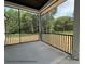 Screened-in patio with views of the backyard and surrounding trees provides peaceful outdoor living at 5104 Lowie Ln # 23, Gastonia, NC 28056