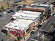 Aerial view showcases commercial properties including a building with a mural at 527 Morrows Turnout Way, Pineville, NC 28134