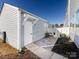 Backyard features a patio, black iron fence and a white wooden fence at 527 Morrows Turnout Way, Pineville, NC 28134