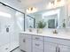 Modern bathroom with double vanity, sleek fixtures, and glass enclosed shower at 527 Morrows Turnout Way, Pineville, NC 28134