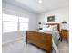 Comfortable bedroom with natural light and classic wooden furniture at 527 Morrows Turnout Way, Pineville, NC 28134