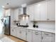 Modern kitchen with white cabinets, stainless steel appliances, subway tile backsplash, and ample counter space at 527 Morrows Turnout Way, Pineville, NC 28134